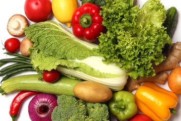 set of different fresh vegetables on wooden background top view closeup. Diet, healthy food, veggie.