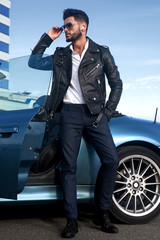 Handsome man near the car. Businessman.