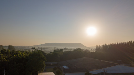 Surfaces on Livestock house, land and Cattle Farm in rural in Thailand with sunrise, fog and mountain background (photo by drone from hight view)