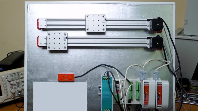 demonstration stand showing the possibilities of modern electronics. Series of servomotors connected with a microcontroller for automatic control of a robotic platform.
