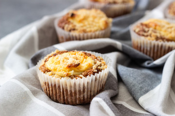Fresh homemade muffins with cream cheese filling and streusel.