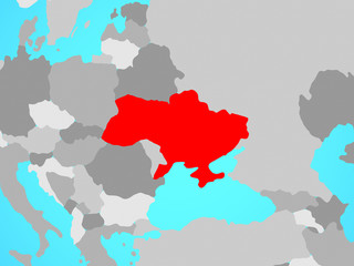 Ukraine on blue political globe.