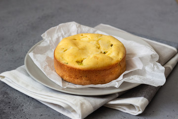 Corn cake with broccoli on parchment paper. 