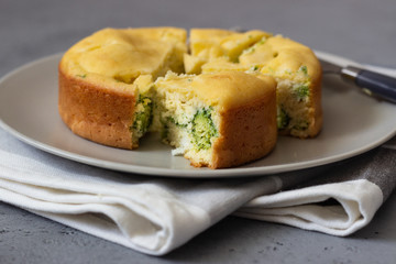 Corn cake with broccoli on parchment paper. 
