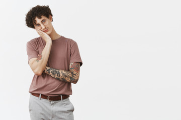 Guy hates sitting at home without action. Portrait of bored handsome and stylish urban young male...