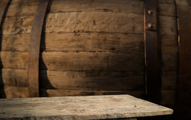 Fototapeta na wymiar background of barrel and worn old table of wood