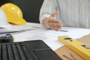 engineer offering handshake. architect ready to shake hand for building construction