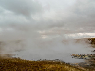Obraz na płótnie Canvas Steaming lake, hot pots in Geothermal active area Krýsuvík, Seltun, Global Geopark, Iceland, Europe