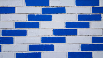 Fototapeta na wymiar Brick wall from blue and white bricks