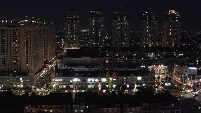 JAKARTA, Indonesia - October 30, 2018: Beautiful aerial view of apartment buildings and Mall of Indonesia complex with night lights in Jakarta, Indonesia. Shot in 4k resolution