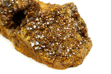 Macro mineral stone Garnet, Green Garnet, Epidote Grossular in the rock on a white background