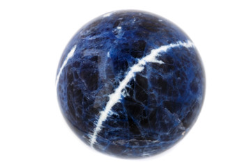 Macro mineral stone Sodalite ball on white background