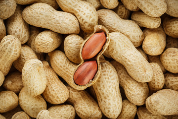 Peeled peanut on well peanuts. Peanuts, for background or textures.