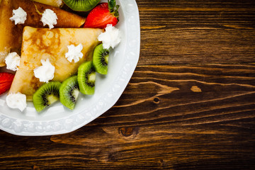 Crepes with fruit and creme