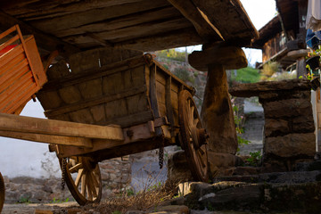 A cart is under an horreo (raised granary)