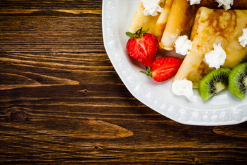 Crepes with fruit and creme