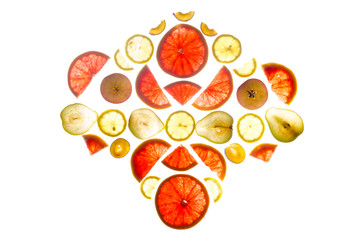 Composition of longitudinal and transverse cuts of fruits of various shapes on the lumen isolated on white background.