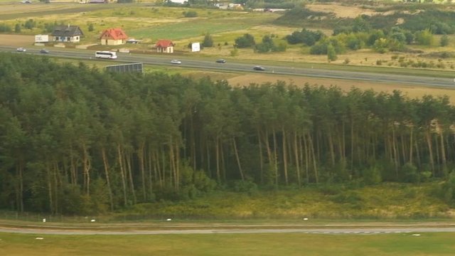 Nowy Dwor, Poland aerial view from window on plane landing flying above airport, rural landscape, countryside near Warsaw