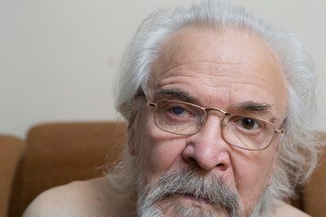 Lonely old man with sore eyes