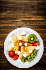 Crepes with fruit and creme