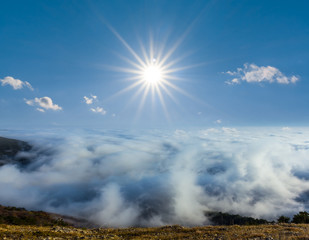 Fototapeta na wymiar mountain plateau above a dense clouds
