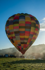 Obraz premium hot air balloon misty take off vertcal