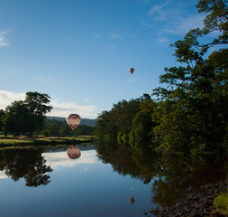 Hot air balloon landing by river