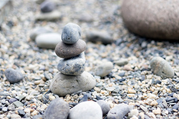 Fototapeta na wymiar Pile of stones in japanese zen garden, copy space, close-up