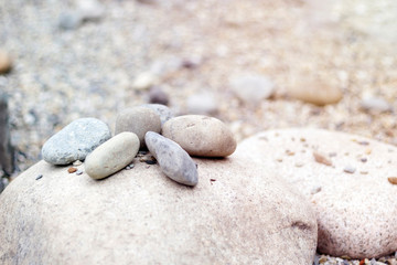 Fototapeta na wymiar Pile of stones with sunlight in japanese zen garden, copy space, close-up