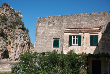Fototapeta na wymiar Scopello, Italy - September 04, 2018 : View of the main building at Tonnara di Scopello