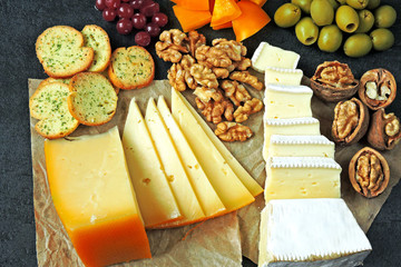 Cheese set, nuts, olives, cranberries, snacks. Keto snack. Keto diet.