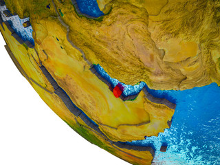 Qatar on model of Earth with country borders and blue oceans with waves.