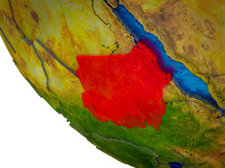 Sudan on model of Earth with country borders and blue oceans with waves.
