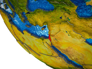 Israel on model of Earth with country borders and blue oceans with waves.