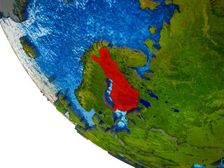 Finland on model of Earth with country borders and blue oceans with waves.