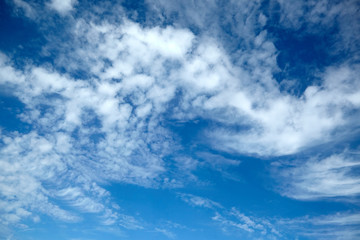 Naklejka na ściany i meble amazing white fluffy clouds on blue sky background