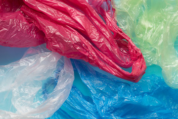 Colorful plastic bags on a blue background