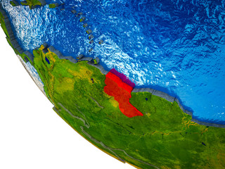 Guyana on model of Earth with country borders and blue oceans with waves.