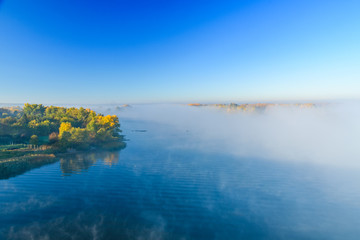 Fog over the water on a river Dnieper on autumn
