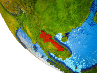Laos on model of Earth with country borders and blue oceans with waves.