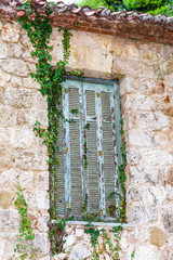 Fototapeta na wymiar Old window details of Tatoi Palace which is a former Greek Royal Family summer residence and birthplace of King George II of Greece