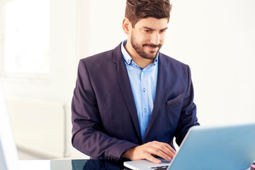 Young financial assitant businessman with notebook in the office