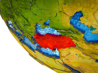 Turkey on model of Earth with country borders and blue oceans with waves.