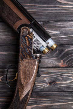 open hunting rifle on a wooden background