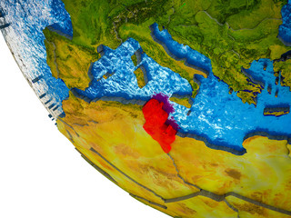 Tunisia on model of Earth with country borders and blue oceans with waves.