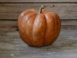 Ripe pumpkin on an old wooden table. Old jack lantern halloween.