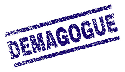 DEMAGOGUE seal print with distress style. Blue vector rubber print of DEMAGOGUE caption with grunge texture. Text caption is placed between parallel lines.