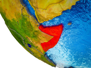 Somalia on model of Earth with country borders and blue oceans with waves.