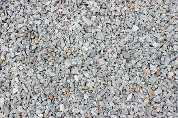Gravel pebble road surface texture background 