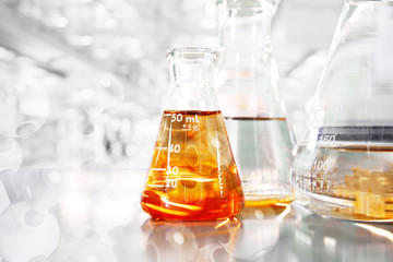 orange so in conical three flasks with chemical structure in science education laboratory